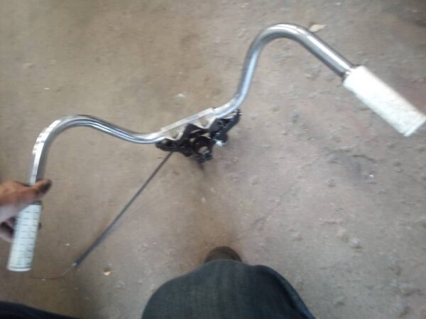 nk model, xlch 2 piece handlebars 52a bottom tree looks to be oem white harley davidson waffle grips, and ball bearing neck cups are included