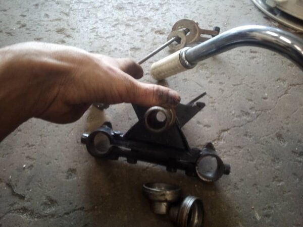 nk model, xlch 2 piece handlebars 52a bottom tree looks to be oem white harley davidson waffle grips, and ball bearing neck cups are included